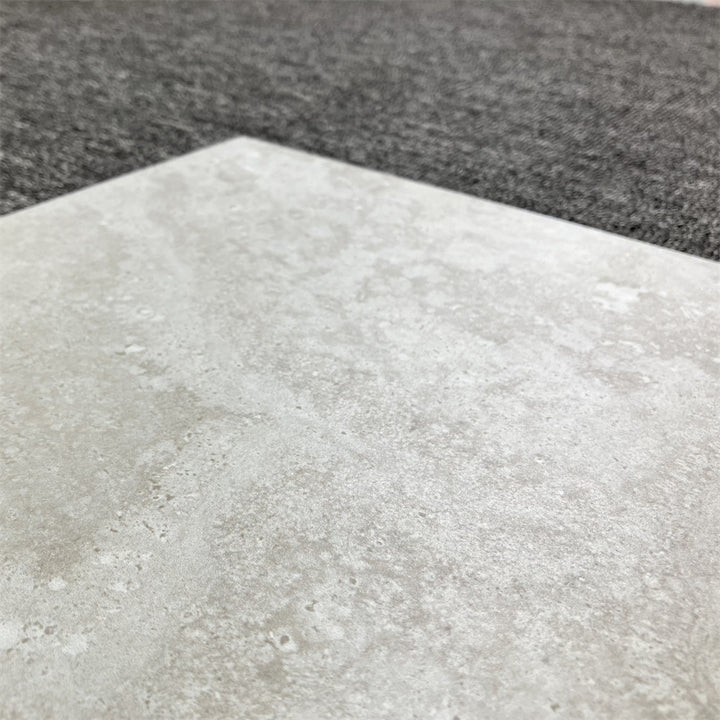 Close-up of Alps Grey 600x600 wall&floor tile showcasing its modern, textured design for indoor and outdoor use.